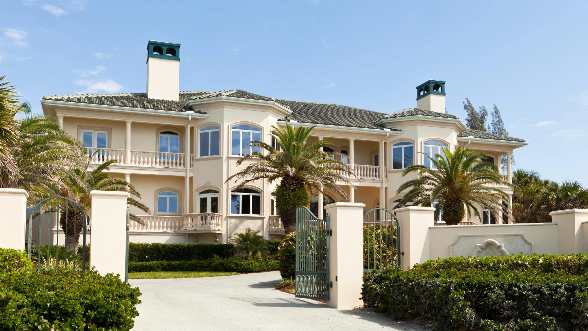 Large property with trimmed hedges and landscaping